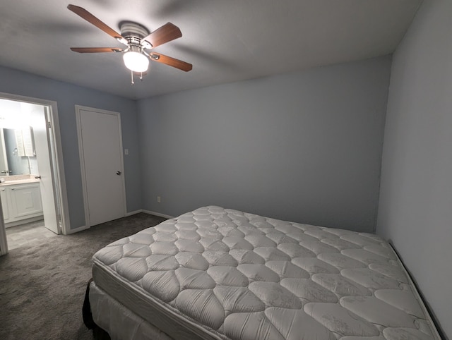 carpeted bedroom featuring ensuite bathroom and ceiling fan