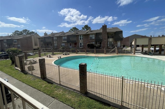 view of swimming pool featuring a patio area