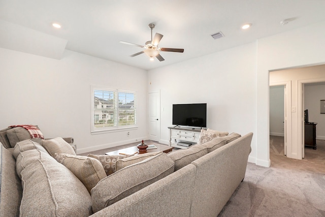 living room with ceiling fan and light carpet