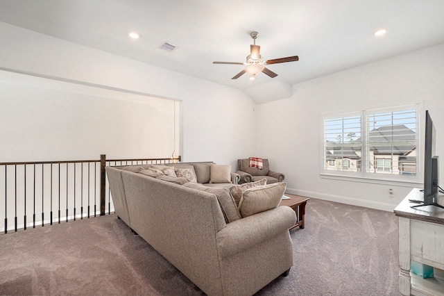 carpeted living room featuring vaulted ceiling and ceiling fan