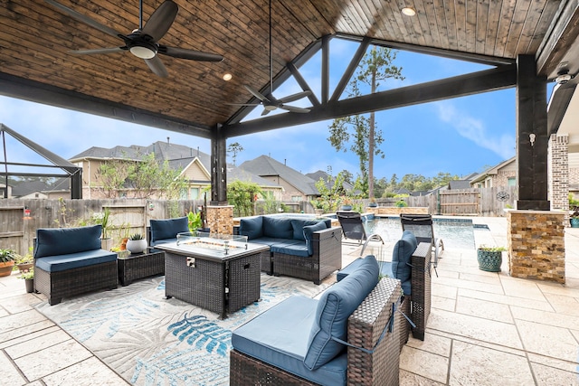 view of patio with ceiling fan, a fenced in pool, and outdoor lounge area