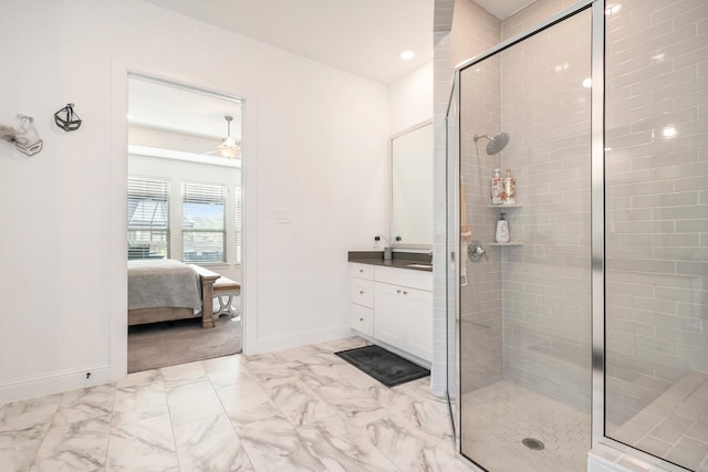 bathroom featuring vanity, walk in shower, and ceiling fan