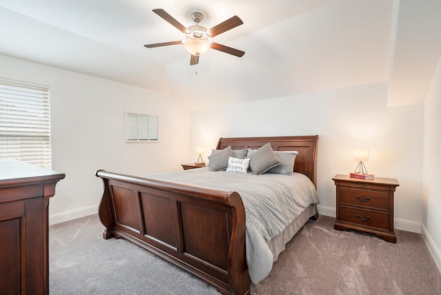 carpeted bedroom with lofted ceiling and ceiling fan