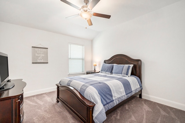 bedroom with ceiling fan, carpet flooring, and vaulted ceiling