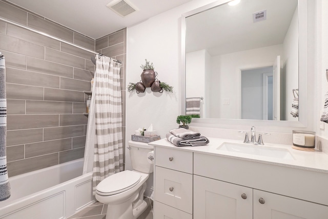 full bathroom with vanity, toilet, tile patterned floors, and shower / tub combo