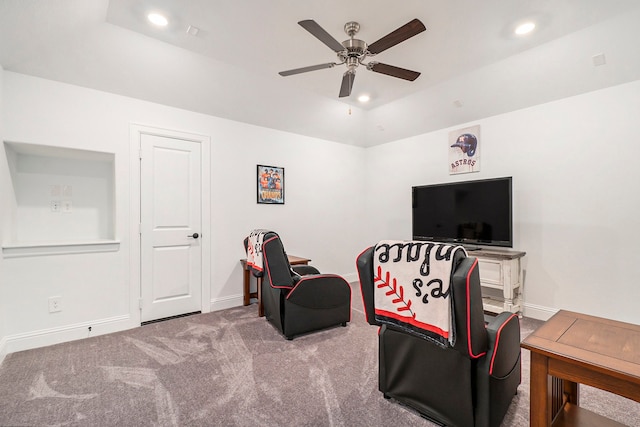 interior space with carpet flooring and ceiling fan