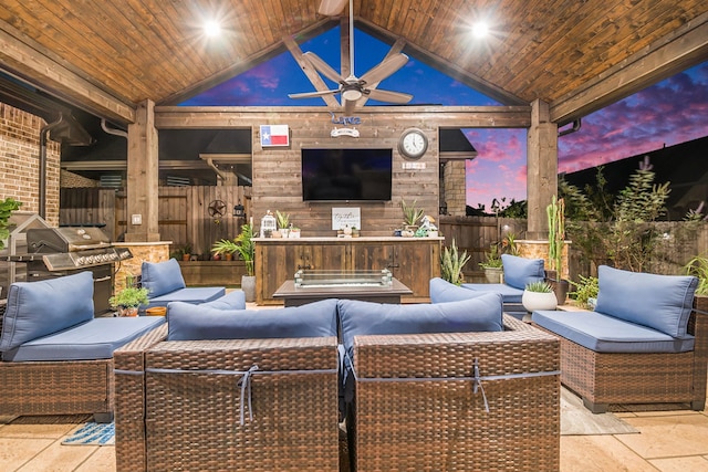 view of patio / terrace featuring an outdoor living space with a fireplace and ceiling fan