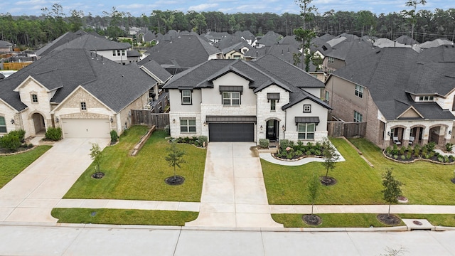 view of front facade featuring a front yard and a garage