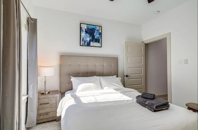 bedroom with light colored carpet