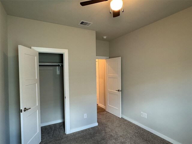 12287 Council Grove Dr, Conroe, TX 77384 - unfurnished bedroom with a ceiling fan, visible vents, baseboards, a closet, and dark carpet