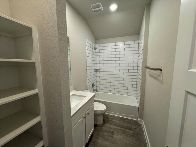 12287 Council Grove Dr, Conroe, TX 77384 - full bath with vanity, shower / bathtub combination, toilet, wood finished floors, and visible vents