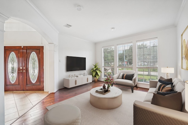 living room featuring ornamental molding and hardwood / wood-style flooring