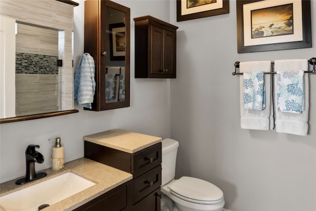 bathroom featuring toilet and vanity