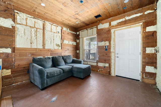 living room with wood walls, wooden ceiling, and dark hardwood / wood-style floors