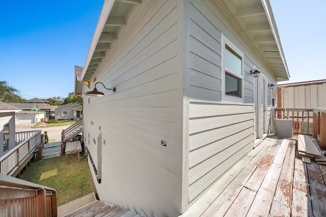 view of side of property with a wooden deck