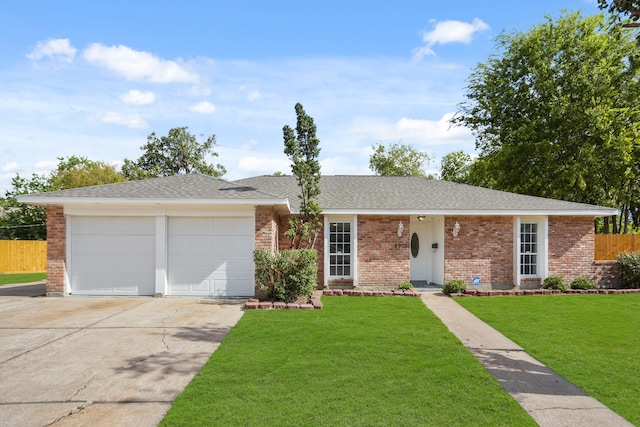 single story home with a front yard and a garage