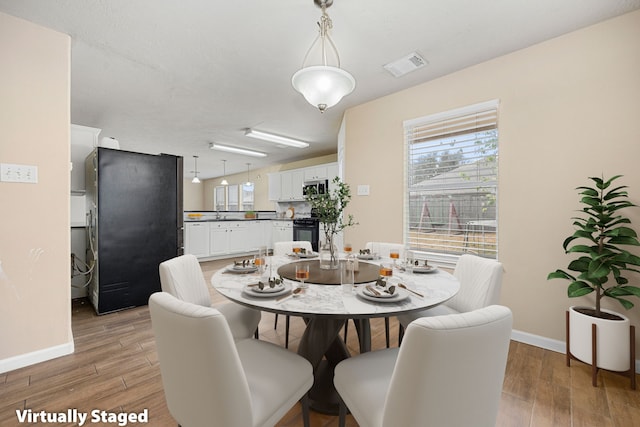 dining area featuring hardwood / wood-style flooring