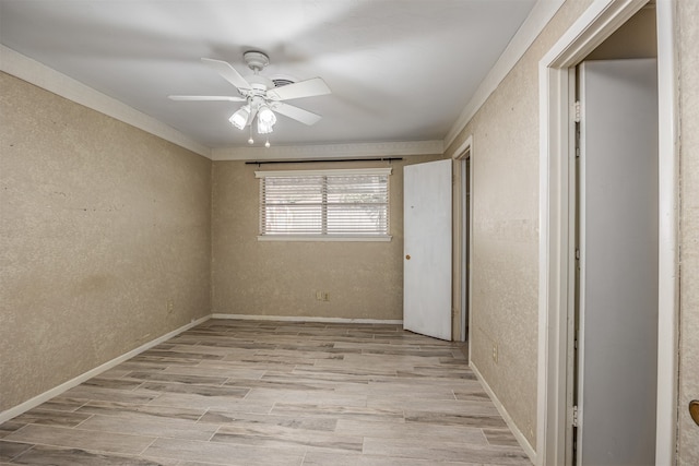 unfurnished bedroom with ceiling fan, crown molding, and light wood-type flooring