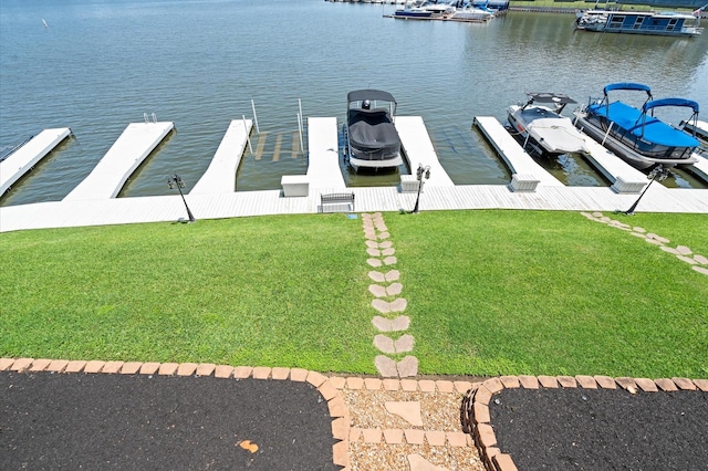 168 Lake Point Blvd Unit C202, Conroe, TX 77356 - dock with a water view and a lawn