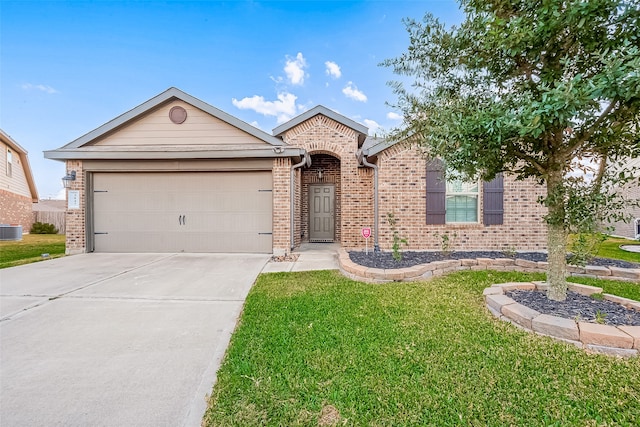 ranch-style home featuring cooling unit, a front yard, and a garage