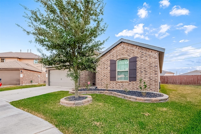 view of front of home featuring a front yard and a garage