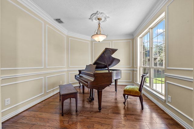 miscellaneous room featuring crown molding, dark hardwood / wood-style floors, and plenty of natural light