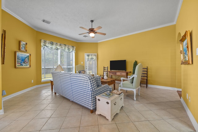 living room featuring crown molding, ceiling fan, a textured ceiling, and light tile patterned floors