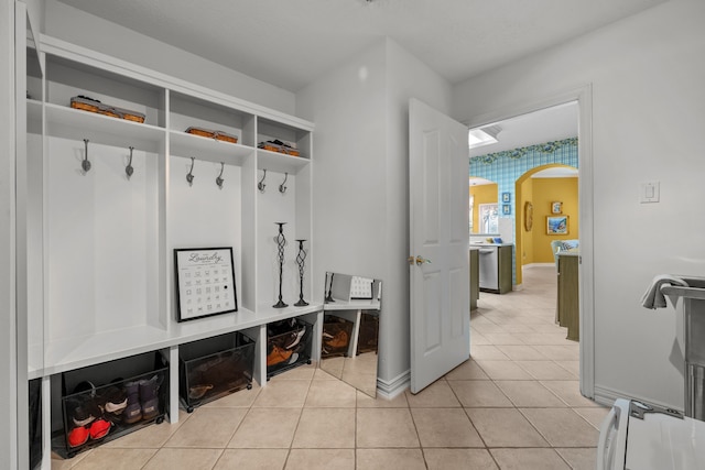 mudroom featuring light tile patterned floors