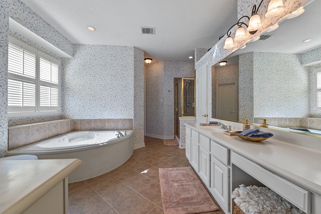 bathroom with vanity, shower with separate bathtub, and tile patterned flooring