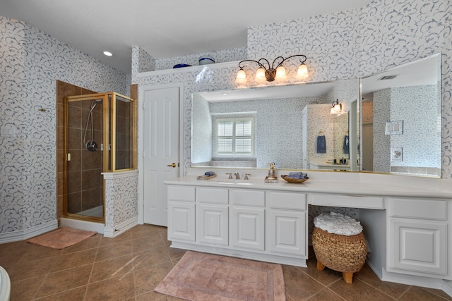 bathroom with vanity, tile patterned floors, and a shower with shower door