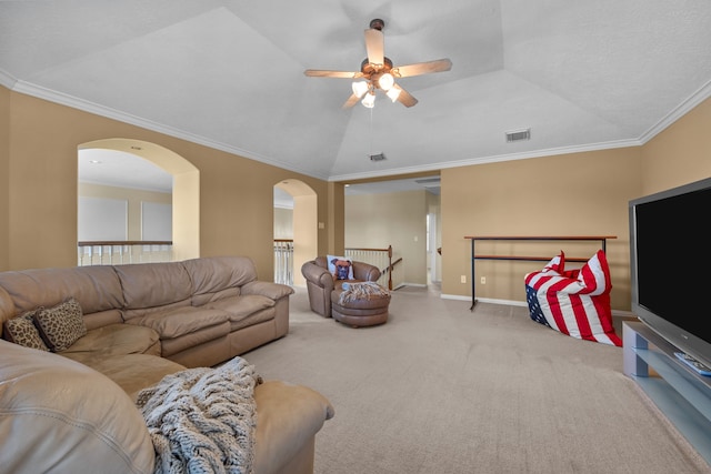 carpeted living room with crown molding, lofted ceiling, and ceiling fan