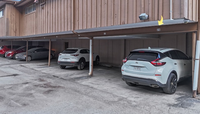 view of parking / parking lot with a carport