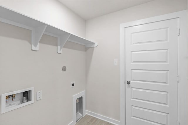 clothes washing area featuring hookup for an electric dryer, light hardwood / wood-style floors, and hookup for a washing machine