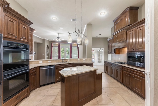 kitchen featuring a center island, tasteful backsplash, hanging light fixtures, kitchen peninsula, and stainless steel appliances