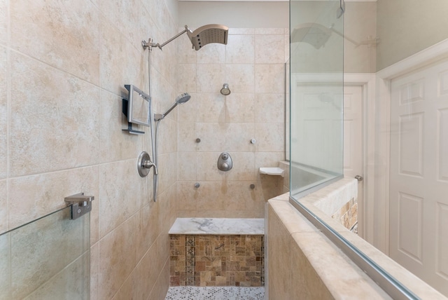 bathroom with a tile shower