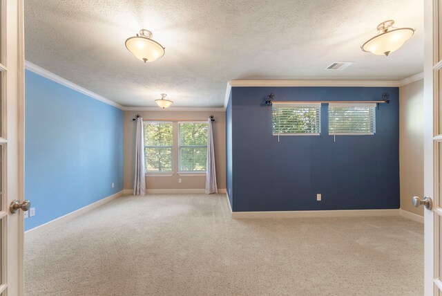 unfurnished room with crown molding and a textured ceiling