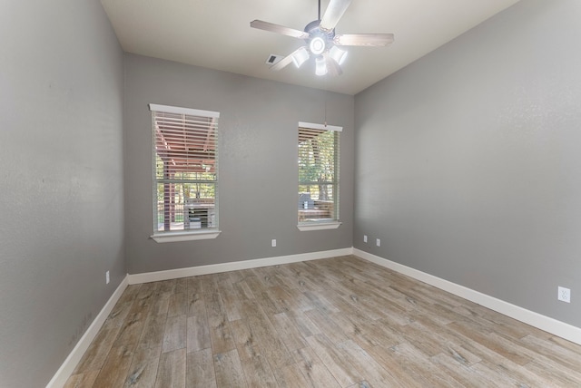 spare room with ceiling fan and light hardwood / wood-style flooring