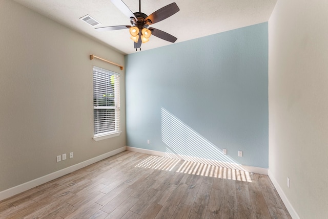 spare room featuring ceiling fan and light hardwood / wood-style flooring