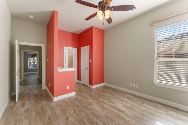 spare room featuring ceiling fan and light hardwood / wood-style flooring