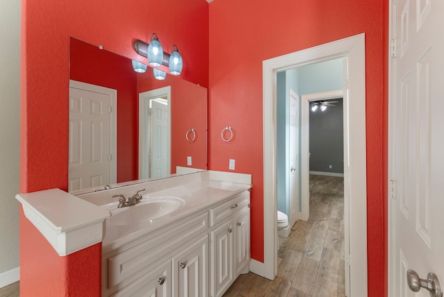 bathroom with toilet and vanity