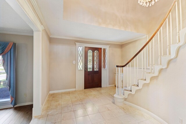 foyer entrance featuring crown molding