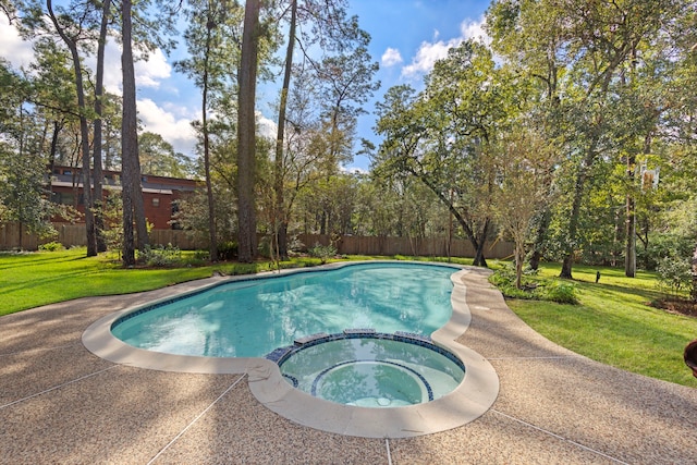 view of pool with an in ground hot tub and a lawn