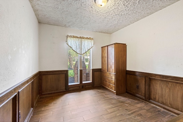 unfurnished room featuring a textured ceiling