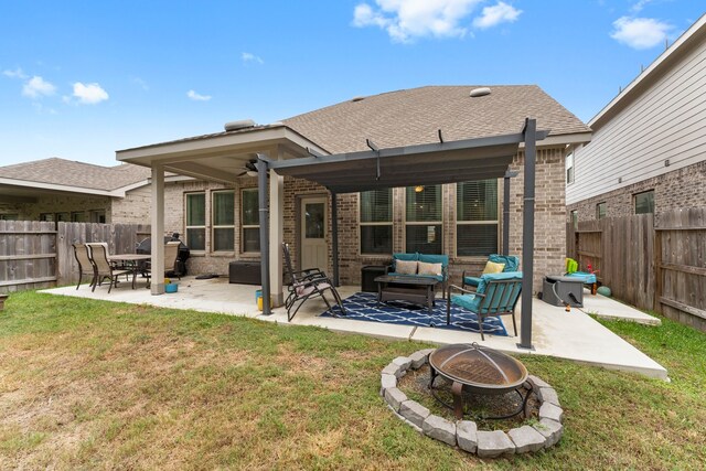 rear view of house featuring an outdoor hangout area, a patio, and a lawn