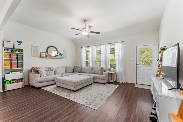 living room featuring ceiling fan and dark hardwood / wood-style flooring