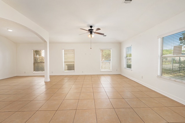 spare room featuring ceiling fan and light tile patterned floors