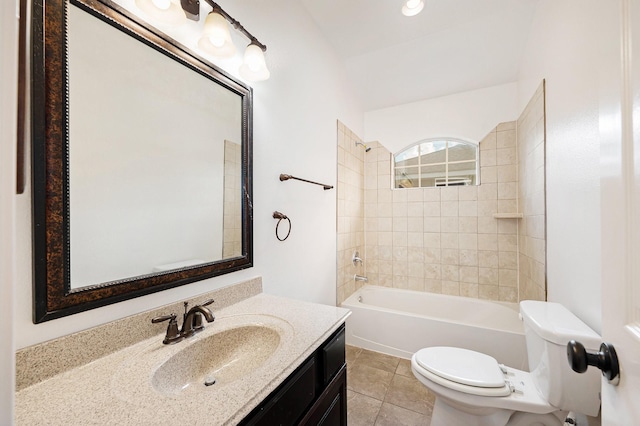 bathroom featuring toilet, tile patterned floors, bathing tub / shower combination, and vanity