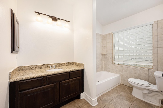 bathroom with a washtub, vaulted ceiling, vanity, tile patterned floors, and toilet