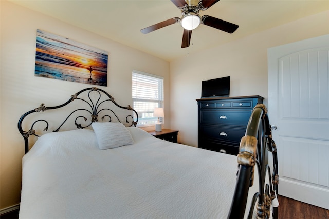 bedroom featuring dark wood-type flooring and ceiling fan