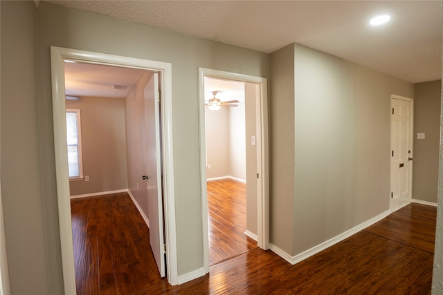 corridor with wood-type flooring